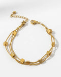 Triple strand gold cube bracelet